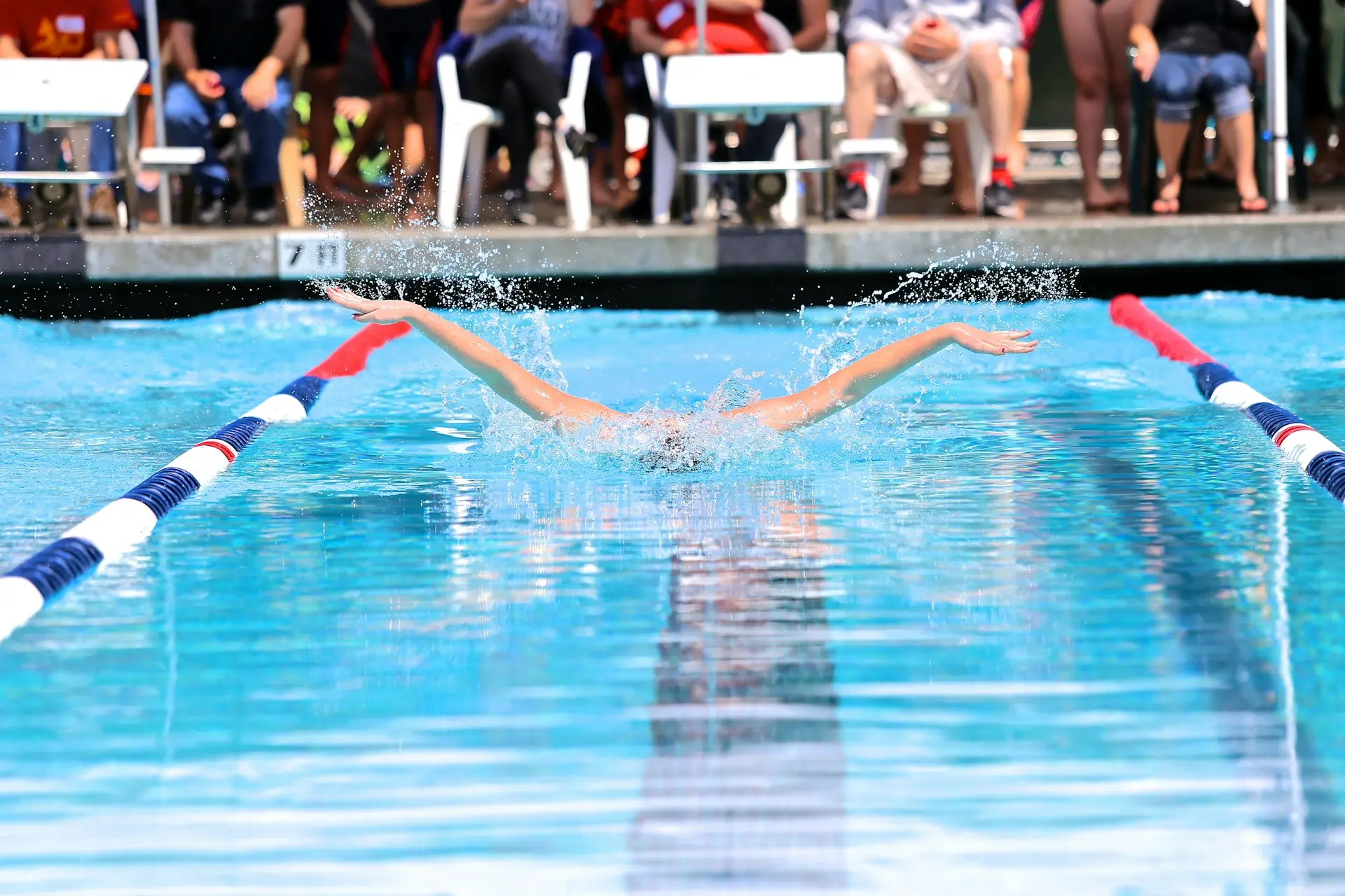 people in swimming pool during daytime