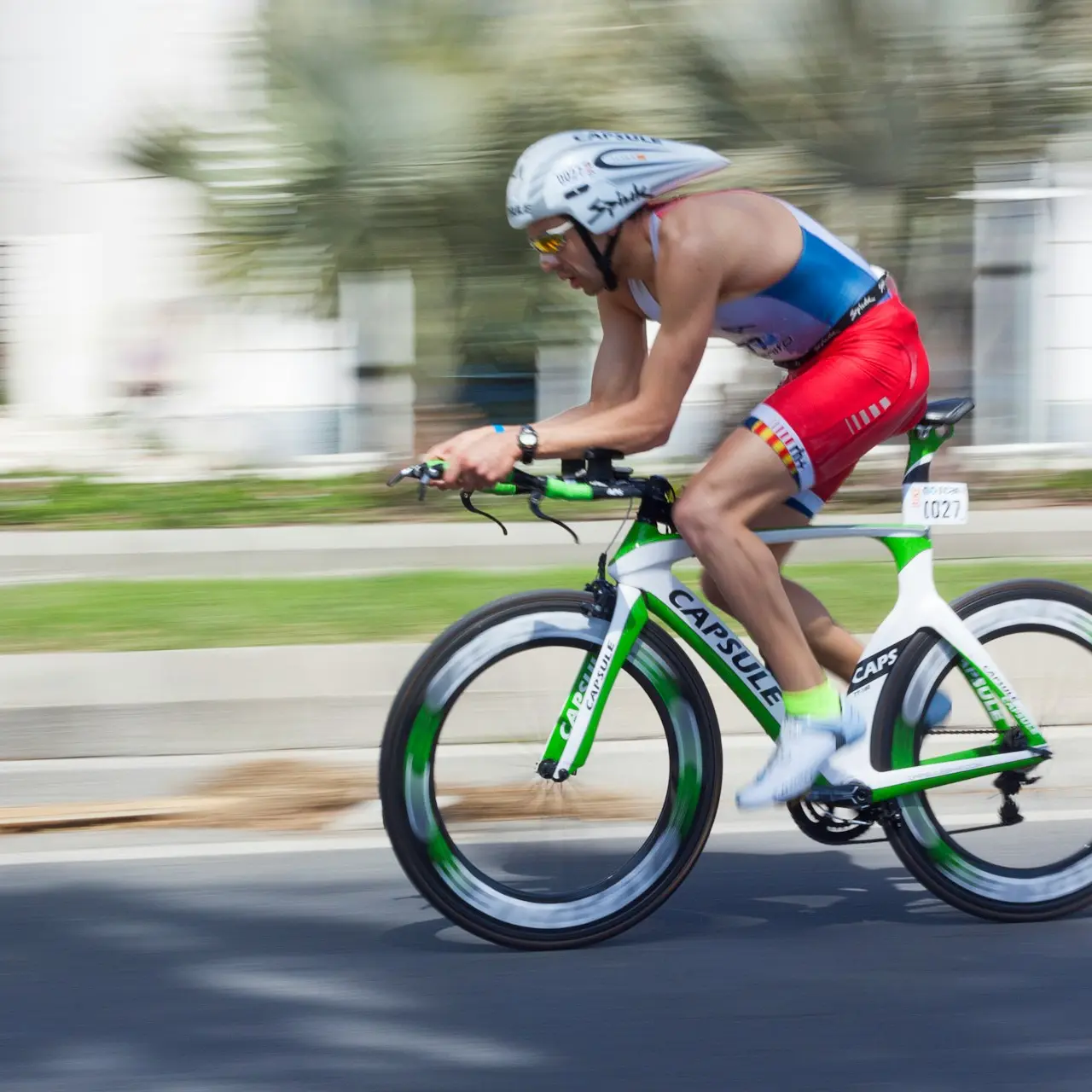 man riding on road bicycle during daytime